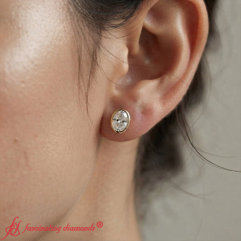 bezel-stud-earring-4-carat-oval-diamond-in-yellow-gold-FDEAR10516OV-fancy-1
