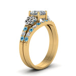 Load image into Gallery viewer, celtic-cushion-cut-diamond-wedding-ring-set-with-blue-topaz-in-yellow-gold-FDENS2255B1CUGICBLTOANGLE2-NL-YG_c0da94e9-0cb7-4cc8-97ce-5d6c80a4d9b5?v=1757065045
