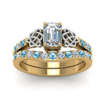 Load image into Gallery viewer, celtic-emerald-cut-diamond-wedding-ring-set-with-blue-topaz-in-yellow-gold-FDENS2255B1EMGICBLTOANGLE5-NL-YG?v=1757056884