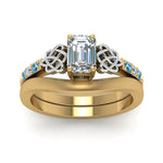 Load image into Gallery viewer, celtic-knot-emerald-cut-diamond-ring-with-plain-band-set-with-blue-topaz-in-yellow-gold-FDENS2255B3EMGICBLTOANGLE5-NL-YG_5399ed53-f497-48ab-86e9-1a14885f7f36?v=1756976829
