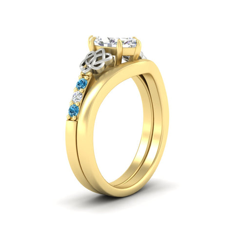 celtic-knot-marquise-cut-blue-topaz-ring-with-plain-band-set-in-yellow-gold-fdens2255mqgicbltoangle2-nl-yg-ws3.jpg