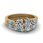 Load image into Gallery viewer, celtic-marquise-cut-diamond-wedding-ring-set-with-blue-topaz-in-yellow-gold-FDENS2255B1MQGICBLTO-NL-YG_06c9924f-97eb-45d9-905d-2783e5a417bf?v=1757056989
