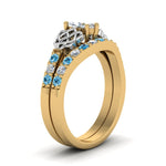 Load image into Gallery viewer, celtic-marquise-cut-diamond-wedding-ring-set-with-blue-topaz-in-yellow-gold-FDENS2255B1MQGICBLTOANGLE2-NL-YG_713bf18c-aae3-4e06-86d7-88ec7715c426?v=1757056989
