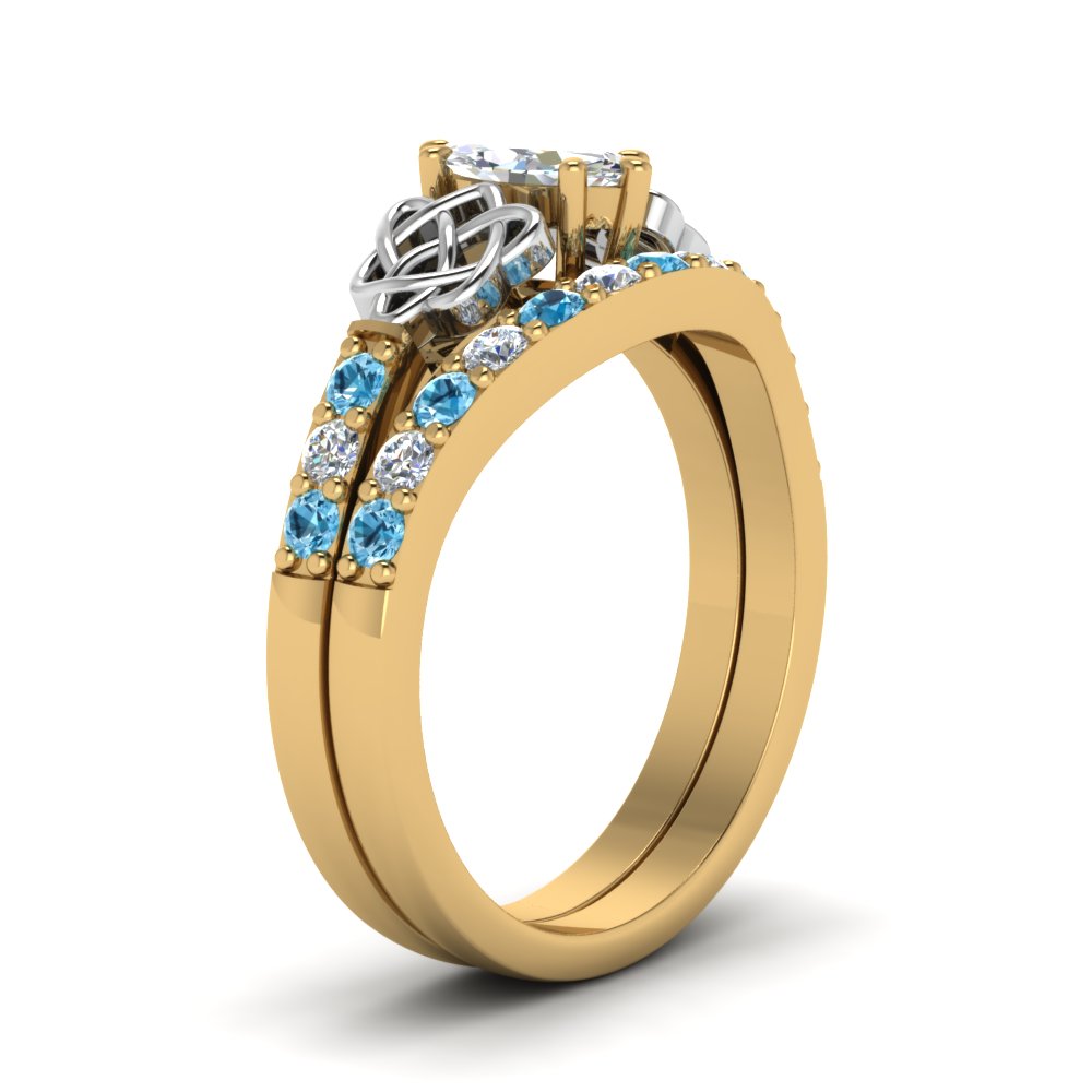 celtic-marquise-cut-diamond-wedding-ring-set-with-blue-topaz-in-yellow-gold-FDENS2255B1MQGICBLTOANGLE2-NL-YG_713bf18c-aae3-4e06-86d7-88ec7715c426?v=1757056989