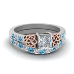 Load image into Gallery viewer, celtic-princess-cut-diamond-wedding-ring-set-with-blue-topaz-in-white-gold-FDENS2255B1PRGICBLTO-NL-WG_7ca3291d-1808-41db-a835-189e29f5c2c1?v=1757057000
