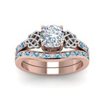 Load image into Gallery viewer, channel-band-cushion-cut-diamond-celtic-bridal-set-with-blue-topaz-in-rose-gold-FDENS2255B2CUGICBLTOANGLE5-NL-RG_9e37cd31-3800-4e33-9c73-0b37a929ee24?v=1756980463
