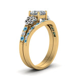 Load image into Gallery viewer, channel-band-cushion-cut-diamond-celtic-bridal-set-with-blue-topaz-in-yellow-gold-FDENS2255B2CUGICBLTOANGLE2-NL-YG_b61c5caa-c394-4866-a0cb-adb81ec9c7f4?v=1756980464
