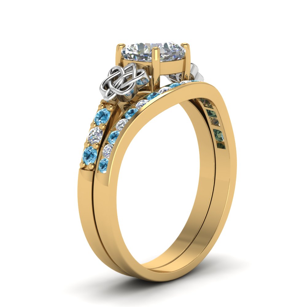 channel-band-cushion-cut-diamond-celtic-bridal-set-with-blue-topaz-in-yellow-gold-FDENS2255B2CUGICBLTOANGLE2-NL-YG_b61c5caa-c394-4866-a0cb-adb81ec9c7f4?v=1756980464