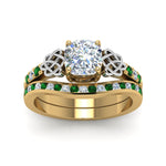 Load image into Gallery viewer, channel-band-cushion-cut-diamond-celtic-bridal-set-with-emerald-in-yellow-gold-FDENS2255B2CUGEMGRANGLE5-NL-YG_c685187a-4ba7-4a3e-bc33-95dc66a175c4?v=1756980464
