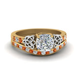Load image into Gallery viewer, channel-band-cushion-cut-diamond-celtic-bridal-set-with-orange-sapphire-in-yellow-gold-FDENS2255B2CUGSAOR-NL-YG_3a8c2eca-50e0-4311-9736-2b778044ff58?v=1756980463
