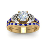 Load image into Gallery viewer, channel-band-cushion-cut-diamond-celtic-bridal-set-with-sapphire-in-yellow-gold-FDENS2255B2CUGSABLANGLE5-NL-YG_cdba454f-fe05-4f2e-8128-f5785fb0a43e?v=1756980464
