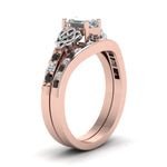 Load image into Gallery viewer, channel-band-emerald-cut-celtic-bridal-set-with-black-diamond-in-rose-gold-FDENS2255B2EMGBLACKANGLE2-NL-RG_e20d0aaa-db48-4dde-9cfe-0def63ec06e7?v=1756980474
