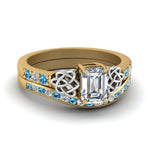Load image into Gallery viewer, channel-band-emerald-cut-diamond-celtic-bridal-set-with-blue-topaz-in-yellow-gold-FDENS2255B2EMGICBLTO-NL-YG
