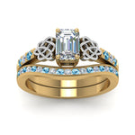 Load image into Gallery viewer, channel-band-emerald-cut-diamond-celtic-bridal-set-with-blue-topaz-in-yellow-gold-FDENS2255B2EMGICBLTOANGLE5-NL-YG_0f588867-ed82-4e72-a338-2bf42595eee7?v=1756980474
