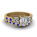 Load image into Gallery viewer, channel-band-emerald-cut-diamond-celtic-bridal-set-with-sapphire-in-yellow-gold-FDENS2255B2EMGSABL-NL-YG
