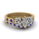 Load image into Gallery viewer, channel-band-marquise-cut-diamond-celtic-bridal-set-with-sapphire-in-yellow-gold-FDENS2255B2MQGSABL-NL-YG_0e725682-8d60-44ea-83d8-19a613279208?v=1756980486
