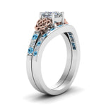 Load image into Gallery viewer, channel-band-princess-cut-diamond-celtic-bridal-set-with-blue-topaz-in-white-gold-FDENS2255B2PRGICBLTOANGLE2-NL-WG_09aadb62-c267-4b25-afb3-79862346caa3?v=1756980496
