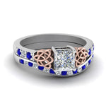 Load image into Gallery viewer, channel-band-princess-cut-diamond-celtic-bridal-set-with-sapphire-in-white-gold-FDENS2255B2PRGSABL-NL-WG_3b59c3ff-657e-4b6a-8ee2-65c7b77b40cd?v=1756980496
