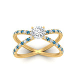 Load image into Gallery viewer, cross-band-cushion-cut-engagment-ring-with-blue-topaz-yellow-gold-FD9890CURGICBLTOANGLE5-NL-YG_8f8aebef-12a0-437b-b8e2-698b260e0f77.jpg?v=1760525946
