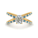 Load image into Gallery viewer, cross-band-emerald-cut-engagment-ring-with-blue-topaz-yellow-gold-FD9890EMRGICBLTO-NL-YG_f4a600f8-99c9-4de0-b6fa-d3dbf7e86cd2.jpg?v=1760525879
