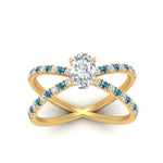 Load image into Gallery viewer, cross-band-oval-shaped-engagment-ring-with-blue-topaz-yellow-gold-FD9890OVRGICBLTOANGLE5-NL-YG.jpg?v=1760525778