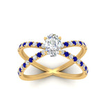 Load image into Gallery viewer, cross-band-oval-shaped-engagment-ring-with-sapphire-yellow-gold-FD9890OVRGSABLANGLE5-NL-YG.jpg?v=1760525778