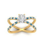 Load image into Gallery viewer, cross-band-radiant-cut-engagment-ring-with-blue-topaz-yellow-gold-FD9890RARGICBLTOANGLE5-NL-YG.jpg?v=1760525827
