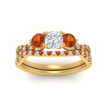Load image into Gallery viewer, cushion-cut-twisted-floral-prong-orange-sapphire-wedding-set-in-yellow-gold-FD10257CUGSAOR-ANGLE5-NL-YG?v=1756359958
