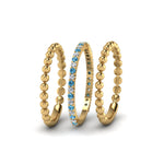 Load image into Gallery viewer, diamond-bead-stack-band-for-women-with-blue-topaz-in-yellow-gold-FD8088ROGICBLTOANGLE3-NL-YG.jpg
