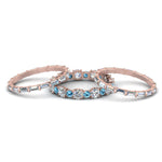 Load image into Gallery viewer, diamond-eternity-stacking-band-with-baguette-and-blue-topaz-in-rose-gold-FD9119GICBLTOANGLE3-NL-RG.jpg
