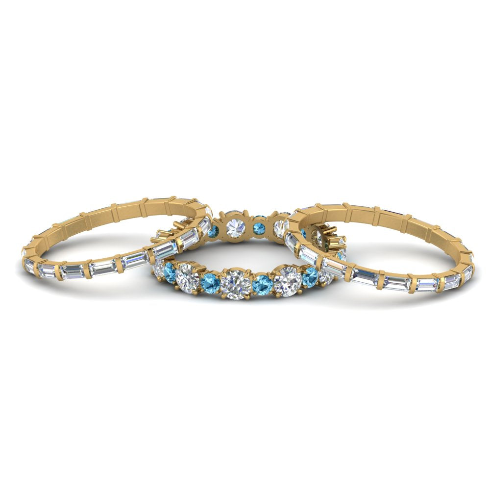 diamond-eternity-stacking-band-with-baguette-and-blue-topaz-in-yellow-gold-FD9119GICBLTOANGLE3-NL-YG.jpg