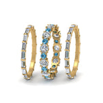 Load image into Gallery viewer, diamond-eternity-stacking-band-with-baguette-and-blue-topaz-in-yellow-gold-FD9119GICBLTOANGLE3-NL-YG.jpg
