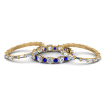 Load image into Gallery viewer, diamond-eternity-stacking-band-with-baguette-and-sapphire-in-yellow-gold-FD9119GSABLANGLE3-NL-YG.jpg
