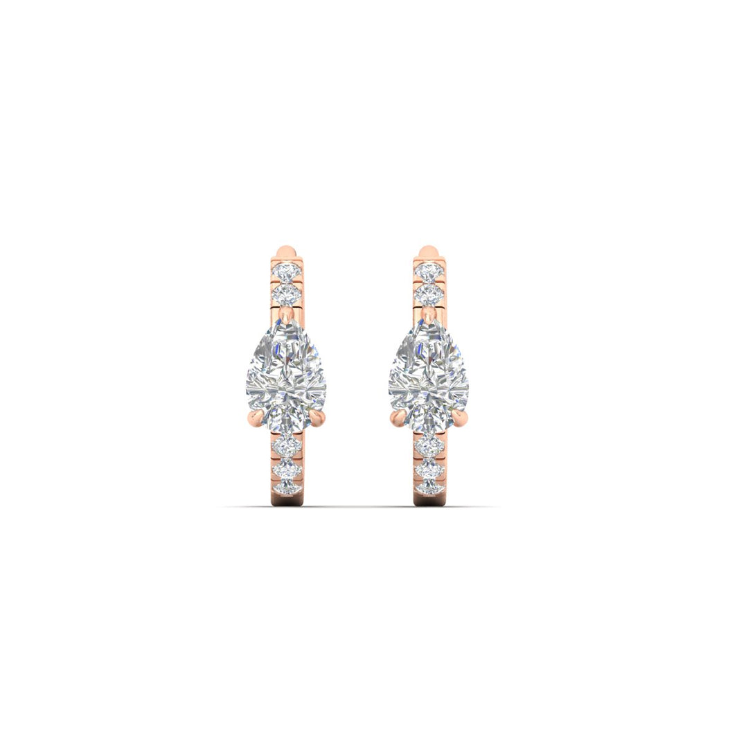 diamond-huggie-earrings-with-pear-center-in-rose-gold-fdear11703angle3-nl-rg.jpg