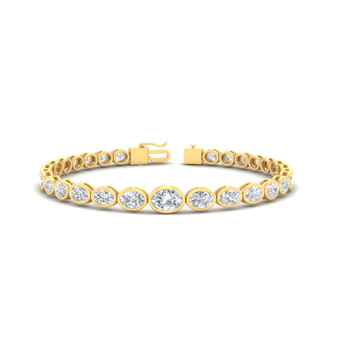 east-west-oval-bezel-tennis-bracelet-in-yellow-gold-fdbrc11733sleep-nl-yg.jpg?v=1776314672