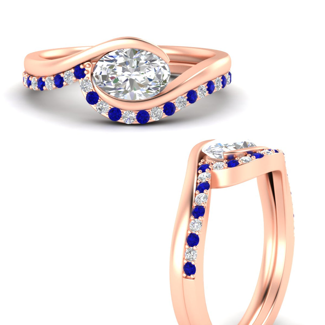 east-west-oval-sapphire-wedding-band-ring-set-in-rose-gold-fdens7806ovgsablangle3-nl-rg_ee11933a-b2ff-46a4-993b-30e9f2343b43.jpg?v=1759992100