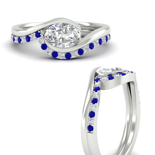 east-west-oval-sapphire-wedding-band-ring-set-in-white-gold-fdens7806ovgsablangle3-nl-wg_7d5e1699-ec72-4437-83f5-cec5de42d771.jpg?v=1759992100