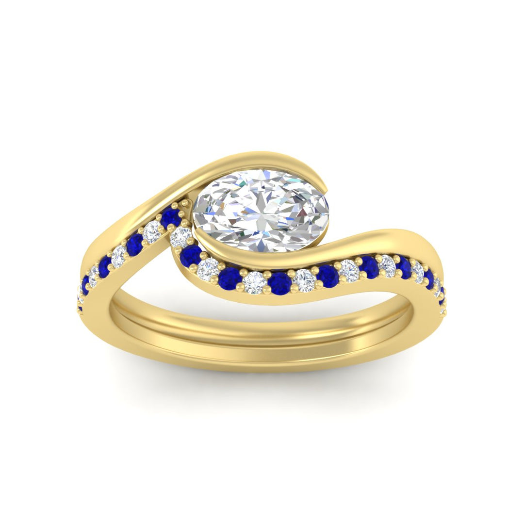 east-west-oval-sapphire-wedding-band-ring-set-in-yellow-gold-fdens7806ovgsablangle5-nl-yg_5450f58e-5093-4f21-916f-3feca99fb7cf.jpg?v=1759992100