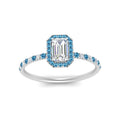 Thumbnail 67 - emerald-cut-blue-topaz-halo-petite-engagement-ring-in-white-gold-FD8523EMRGICBLTOANGLE3-NL-WG