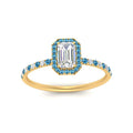 Thumbnail 103 - emerald-cut-blue-topaz-halo-petite-engagement-ring-in-yellow-gold-FD8523EMRGICBLTOANGLE3-NL-YG
