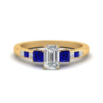 Load image into Gallery viewer, emerald-cut-channel-three-stone-diamond-engagement-ring-with-sapphire-in-yellow-gold-FDENS205EMRGSABL-NL-YG.jpg
