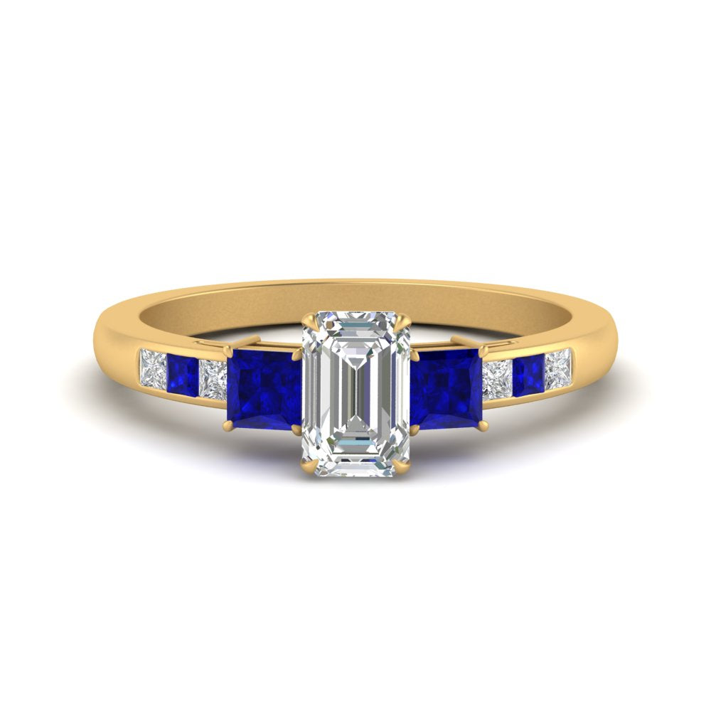 emerald-cut-channel-three-stone-diamond-engagement-ring-with-sapphire-in-yellow-gold-FDENS205EMRGSABL-NL-YG.jpg