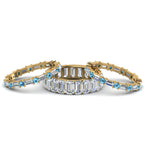 Load image into Gallery viewer, emerald-cut-eternity-band-with-matching-baguette-and-round-with-ice-blue-topaz-in-18K-yellow-gold-FD8331BGICBLTOANGLE1-NL-YG_96e560c8-4864-4fac-b0bb-fa30c13a4b81
