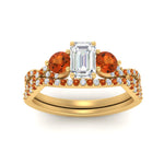 Load image into Gallery viewer, emerald-cut-twisted-floral-prong-orange-sapphire-wedding-set-in-yellow-gold-FD10257EMGSAOR-ANGLE5-NL-YG?v=1756359975
