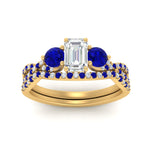 Load image into Gallery viewer, emerald-cut-twisted-floral-prong-sapphire-wedding-set-in-yellow-gold-FD10257EMGSABL-ANGLE5-NL-YG_d69e5c24-c788-4cc2-b6fa-d8d2f84c02e1?v=1756360117
