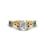 Load image into Gallery viewer, entwined-celtic-emerald-cut-love-knot-blue-topaz-engagement-ring-in-yellow-gold-FD9306EMRGICBLTO-NL-YG
