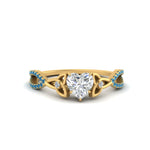 Load image into Gallery viewer, entwined-celtic-heart-shaped-love-knot-blue-topaz-engagement-ring-in-yellow-gold-FD9306HTRGICBLTO-NL-YG
