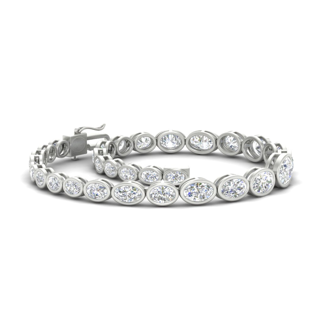 graduated-bezel-oval-east-west-tennis-bracelet-in-white-gold-fdbrc11733angle4-nl-wg.jpg?v=1776313785