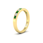 Load image into Gallery viewer, half-carat-channel-set-diamond-wedding-band-with-emerald-in-yellow-gold-FDWB5242ROGEMGRANGLE2-0.50CT-NL-YG
