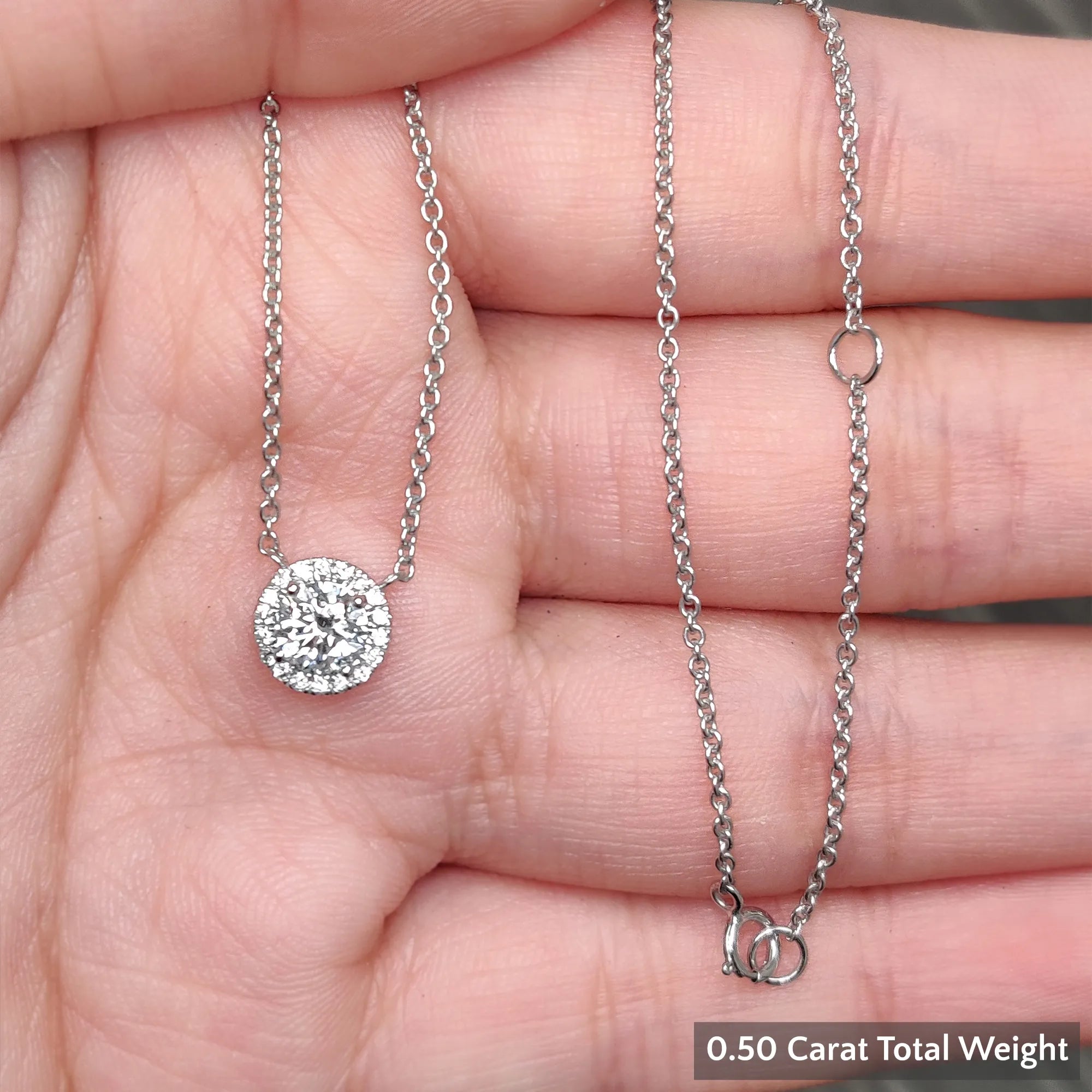 Half  carat halo diamond pendant in WG